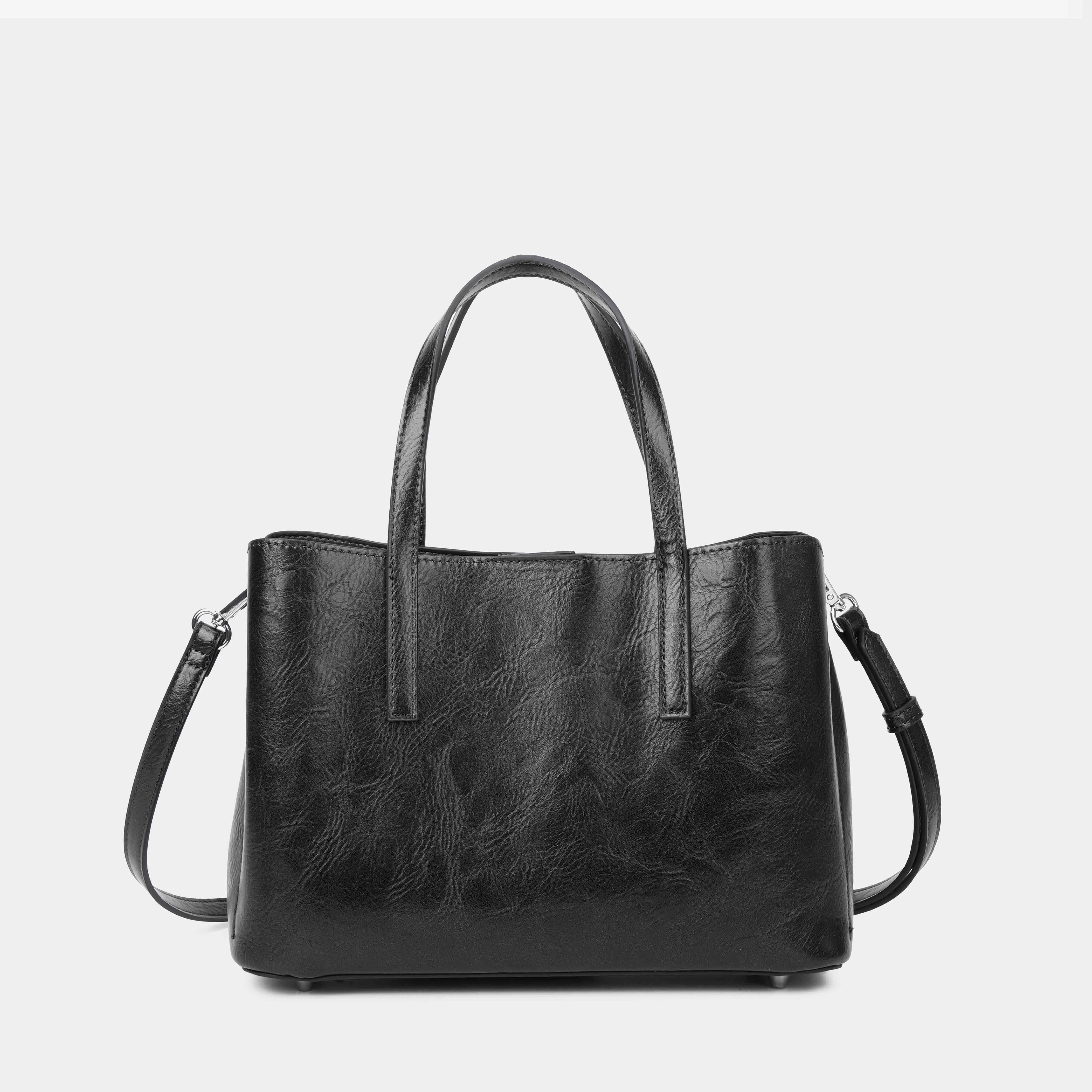 Bolsos de mano Sevilla con tachas metálicas